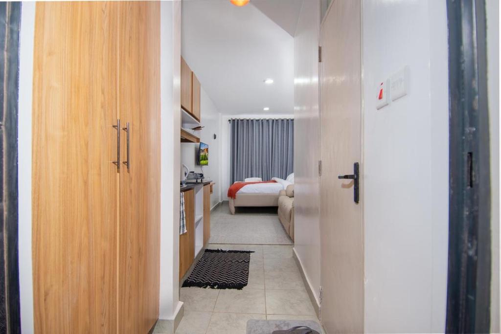 Ένα ή περισσότερα κρεβάτια σε δωμάτιο στο Royal suburbs by Tsavo