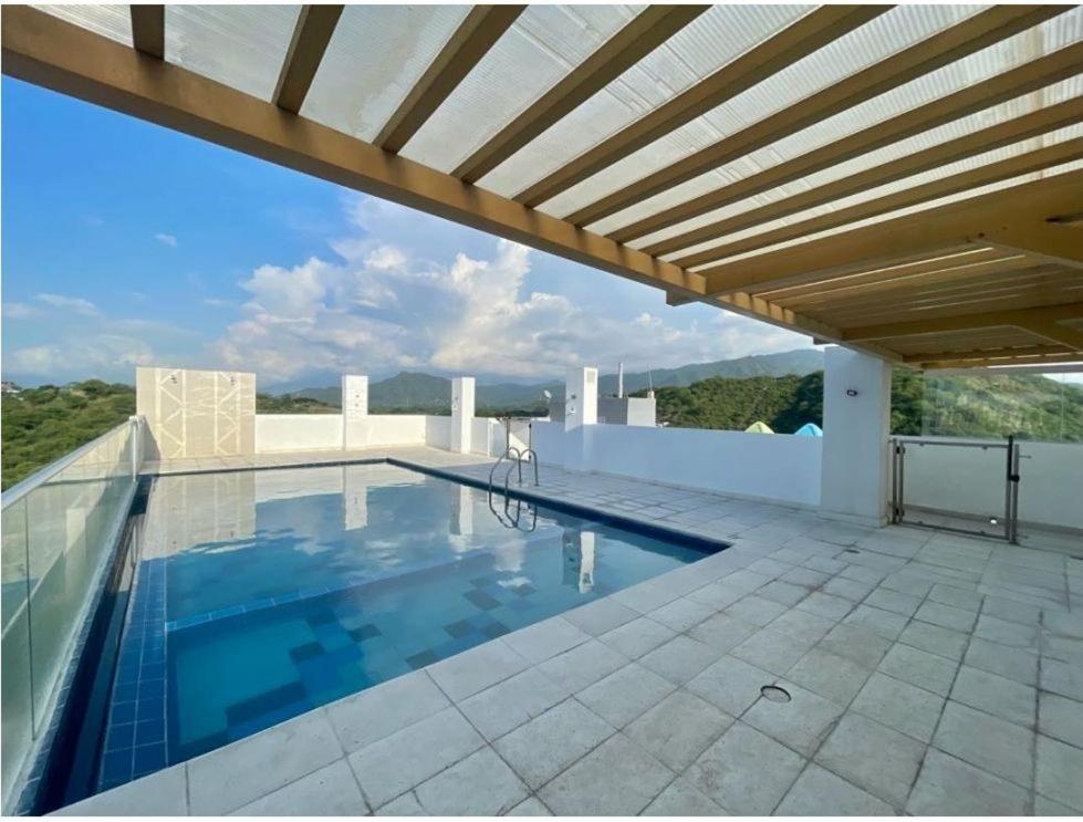 a swimming pool on the roof of a house at BAM - Hospedajes in Santa Marta