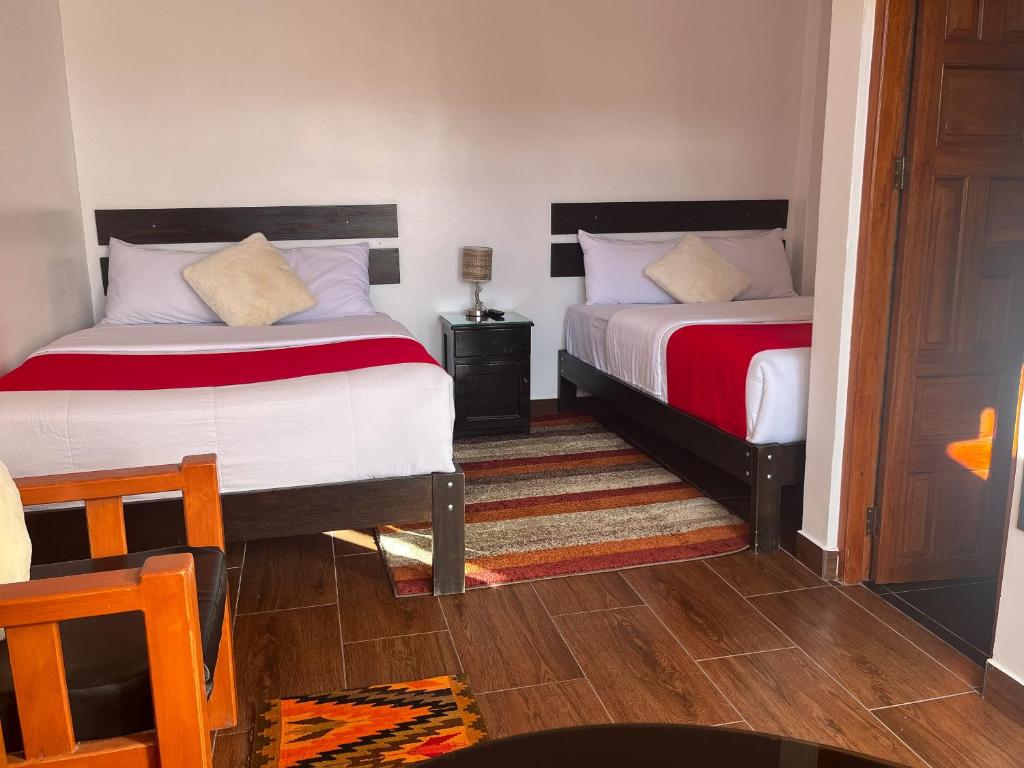 Postel nebo postele na pokoji v ubytování Cusco and Rock