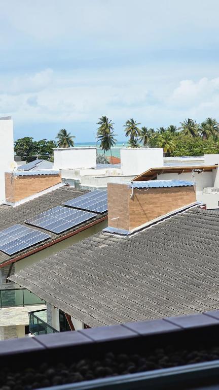 a group of roofs with solar panels on them at Refúgio próximo ao mar in Cabedelo