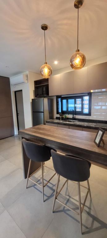 Η κουζίνα ή μικρή κουζίνα στο Departamentos Premium