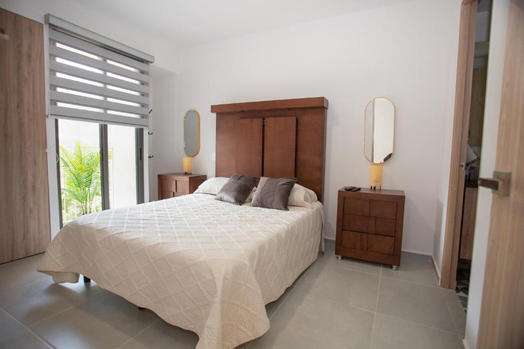 Postel nebo postele na pokoji v ubytování Villadhara Centro GDL