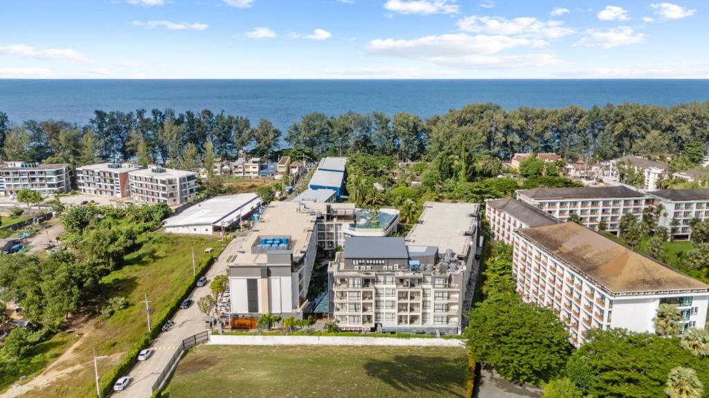 an aerial view of a city with the ocean at Modern 1506 Condo in Wyndham Gardens on the beach in Nai Thon Beach