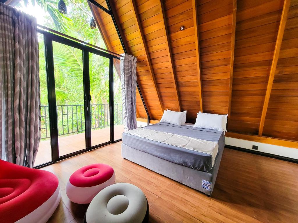 Postel nebo postele na pokoji v ubytování Shenu Villa