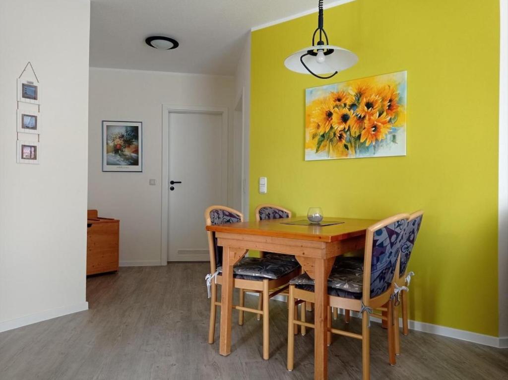 a dining room with a wooden table and chairs at Orth - E37 in Orth
