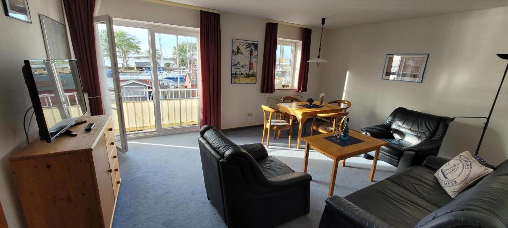 a living room with a couch and a table at Blue Water in Orth