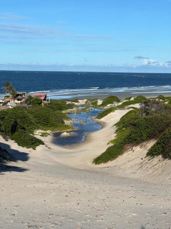 an aerial view of a beach and the ocean at Pousada Rosa de Saron - Algodoal in Algodoal