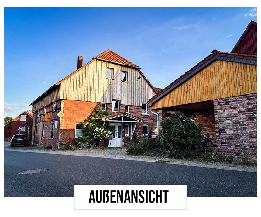 a large brick building on the side of a street at Landhaus in Springe