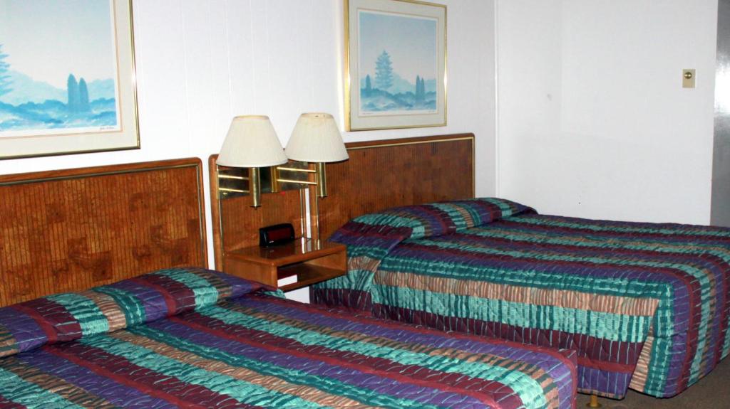 Postel nebo postele na pokoji v ubytování Motel 101