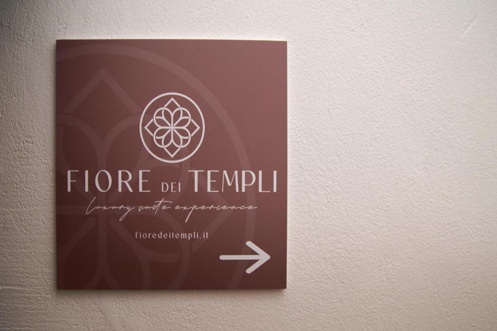 a sign on a wall that says flore der tempol at Fiore dei Templi - luxury suite experience in Agrigento