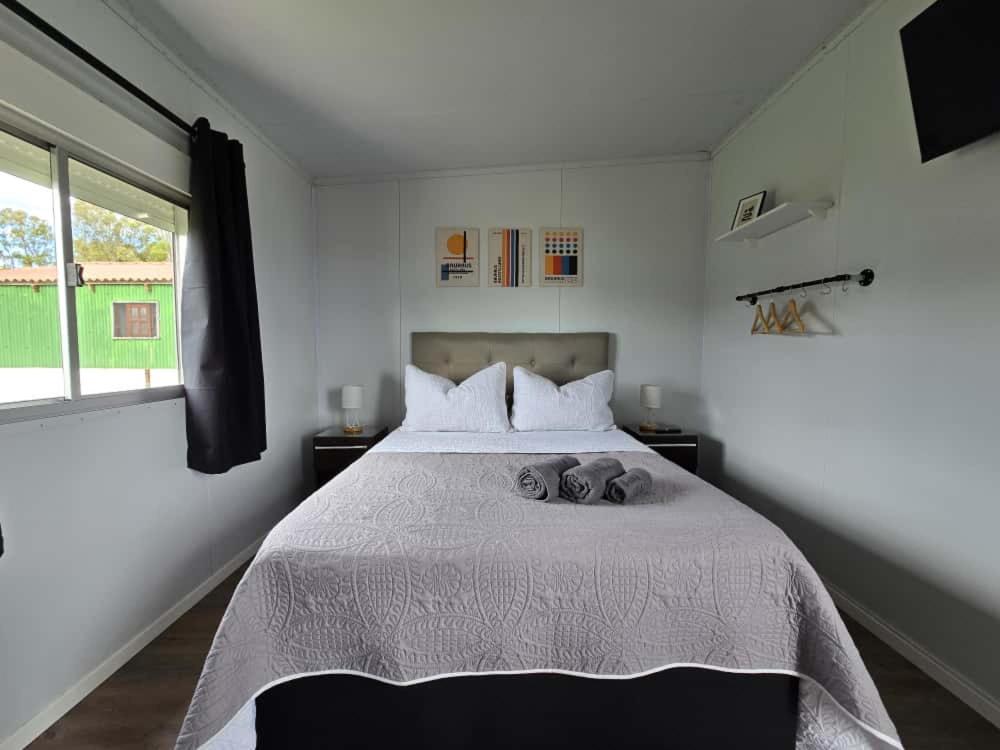 a bedroom with a bed with two stuffed animals on it at Maridalba 2 in La Coronilla