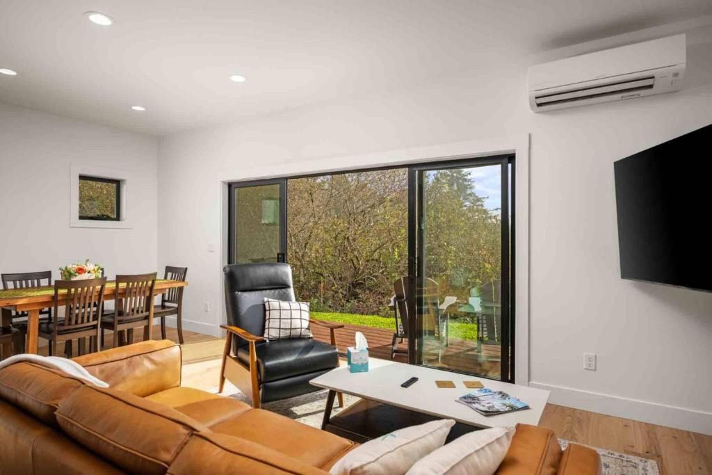 a living room with a couch and a table at Lake & Laughter Unit 2 in Rockaway Beach