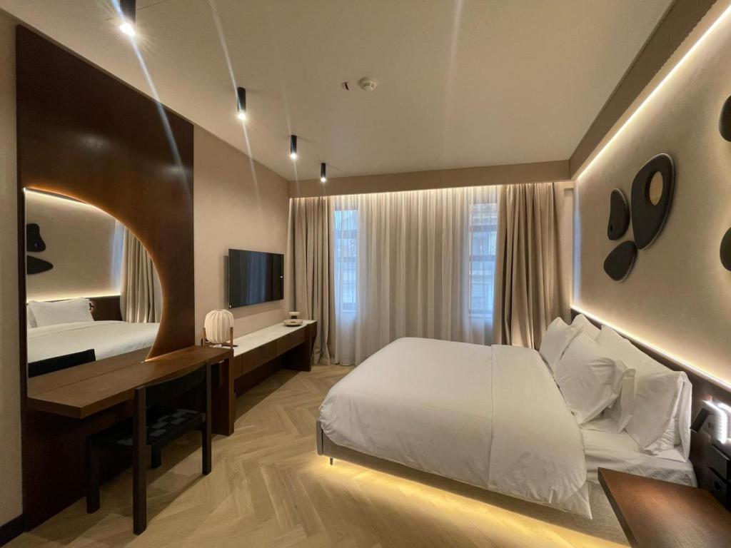 Ένα ή περισσότερα κρεβάτια σε δωμάτιο στο Hotel Trianon