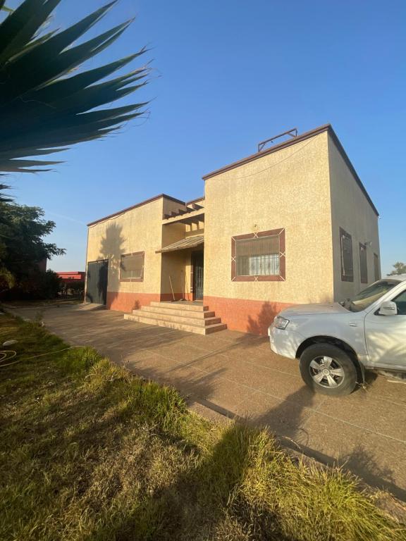a car parked in front of a building at Villa dar deyafa jamaat fedalat in Sidi Moussa Ben Ali