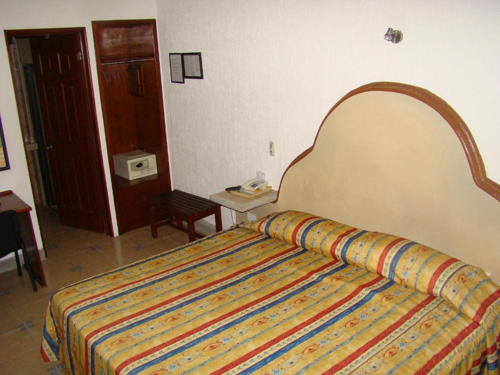 Postel nebo postele na pokoji v ubytování Hotel Fenix