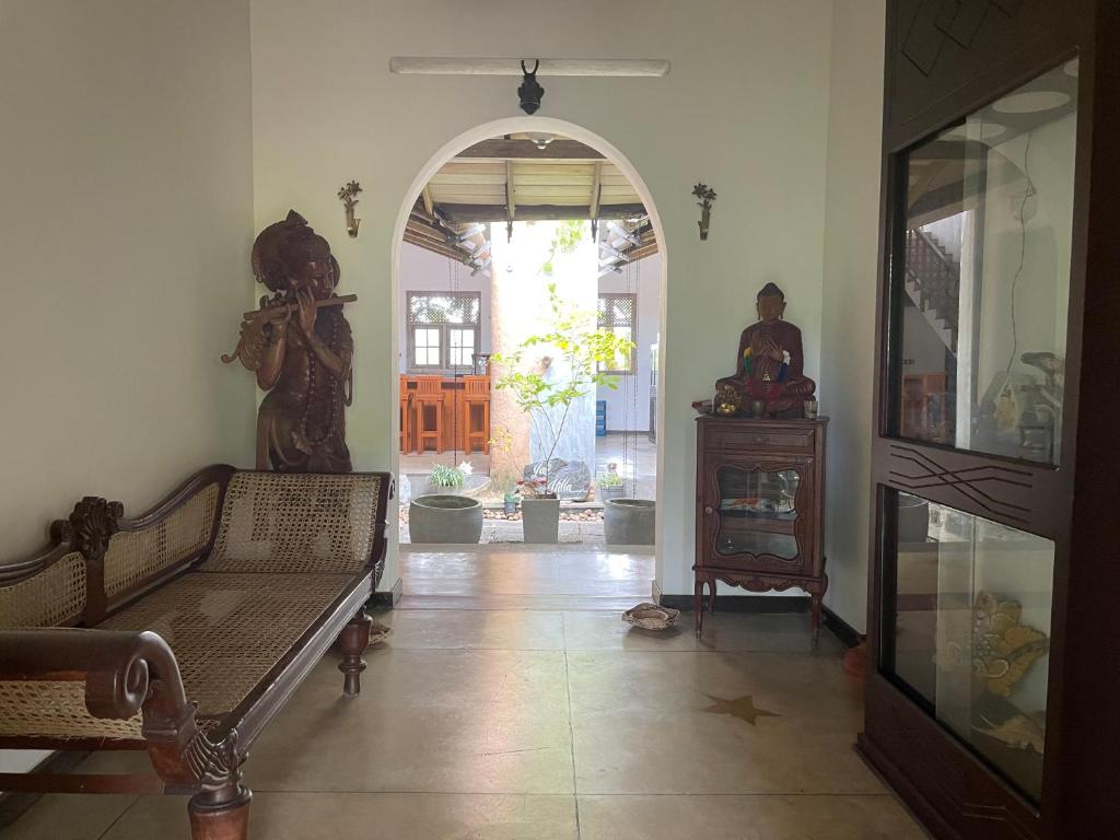 a living room with a couch and an entry way at Lali Villa in Galle