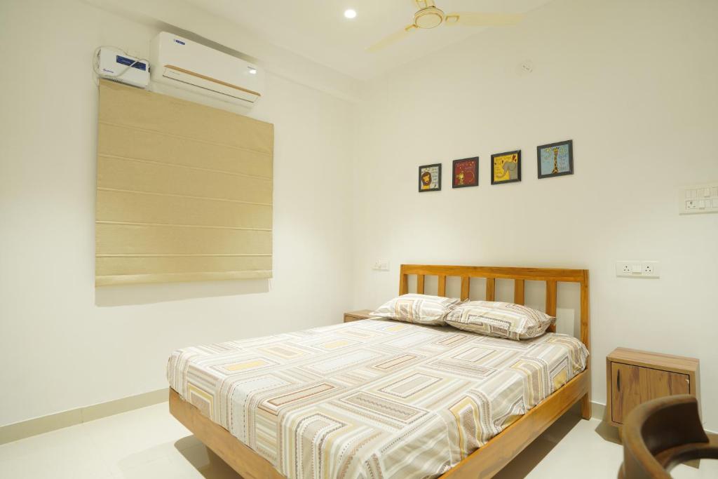 Ένα ή περισσότερα κρεβάτια σε δωμάτιο στο ikigai homes