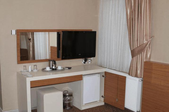 TV a/nebo společenská místnost v ubytování Tac Hotel