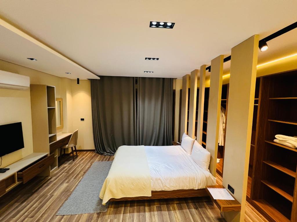 Ένα ή περισσότερα κρεβάτια σε δωμάτιο στο Farida Grand Hotel