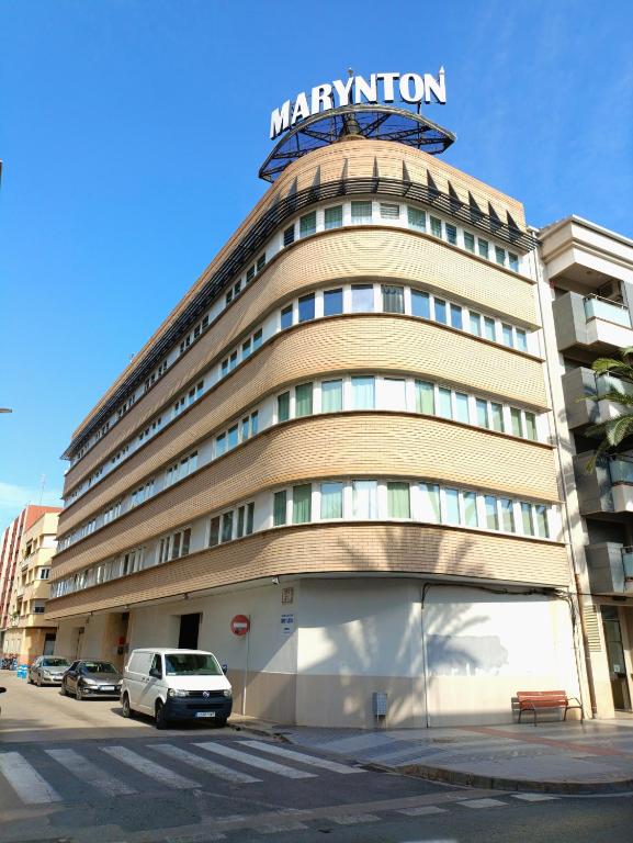 a large building with a sign on top of it at Marynton Boutique in Benicarló