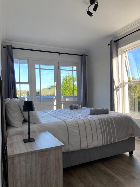 Postel nebo postele na pokoji v ubytování Sunny Side Apartment