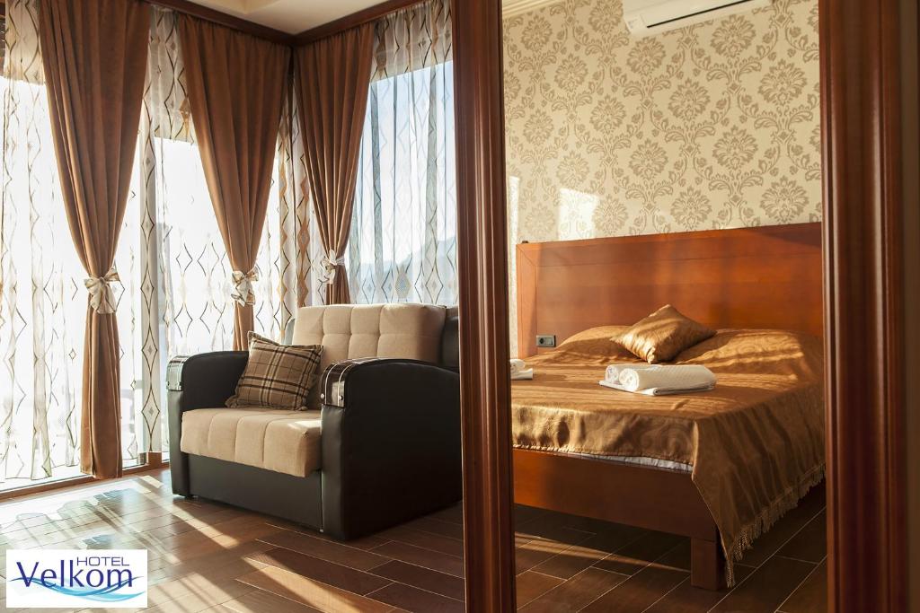Postel nebo postele na pokoji v ubytování Hotel Velkom