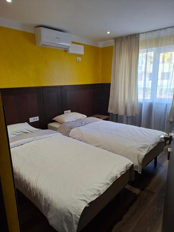 Postel nebo postele na pokoji v ubytování Apartament LaPassione Tecuci