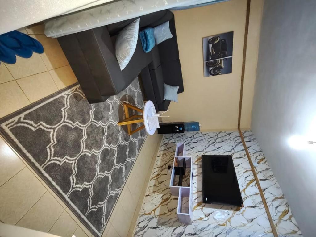 an overhead view of a room with a bed at 1 Bedroom in Section 58 behind Kunste Hotel in Nakuru