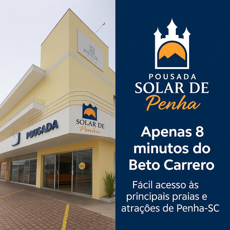 a building with a sign in front of it at Pousada Solar de Penha in Penha