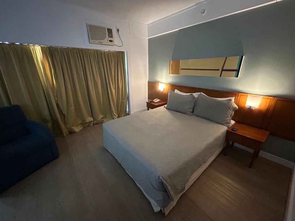 Ένα ή περισσότερα κρεβάτια σε δωμάτιο στο Hotel Ibirapuera V Mariana Borges Lagoa c garagem 407