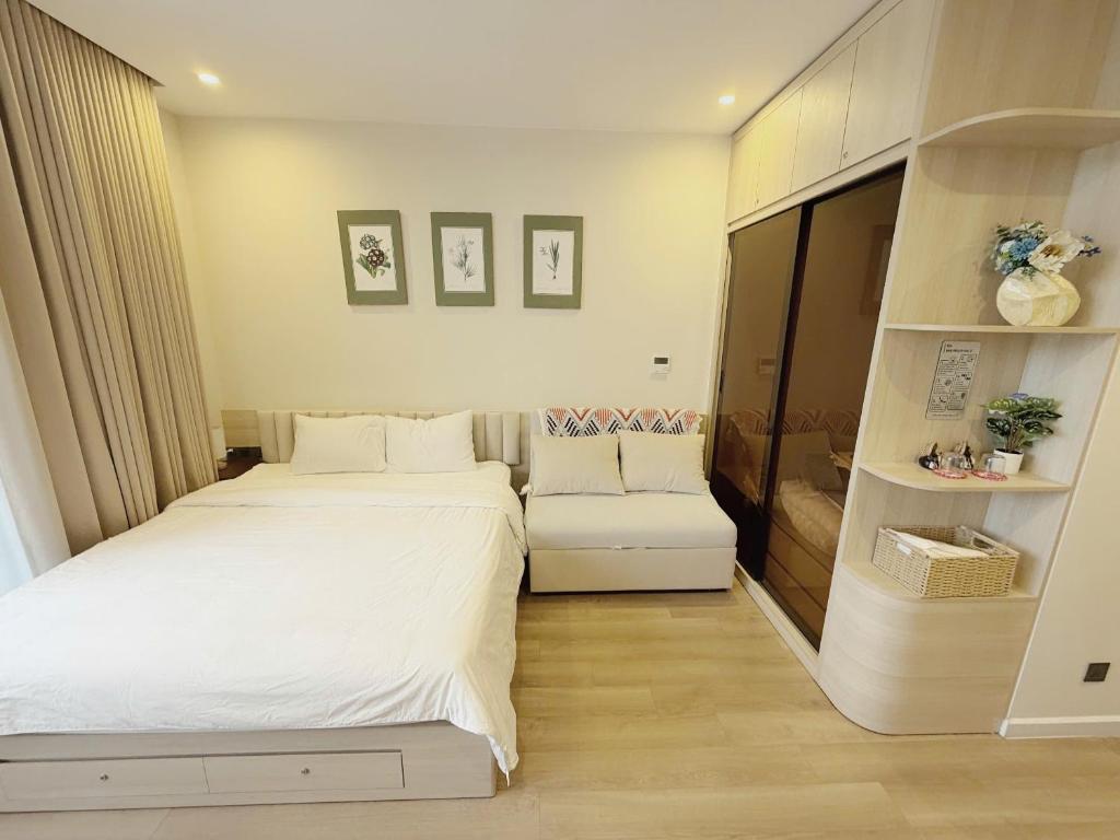 Postel nebo postele na pokoji v ubytování Villa 3-5 Phòng Ngủ Đầy Đủ Tiện Nghi