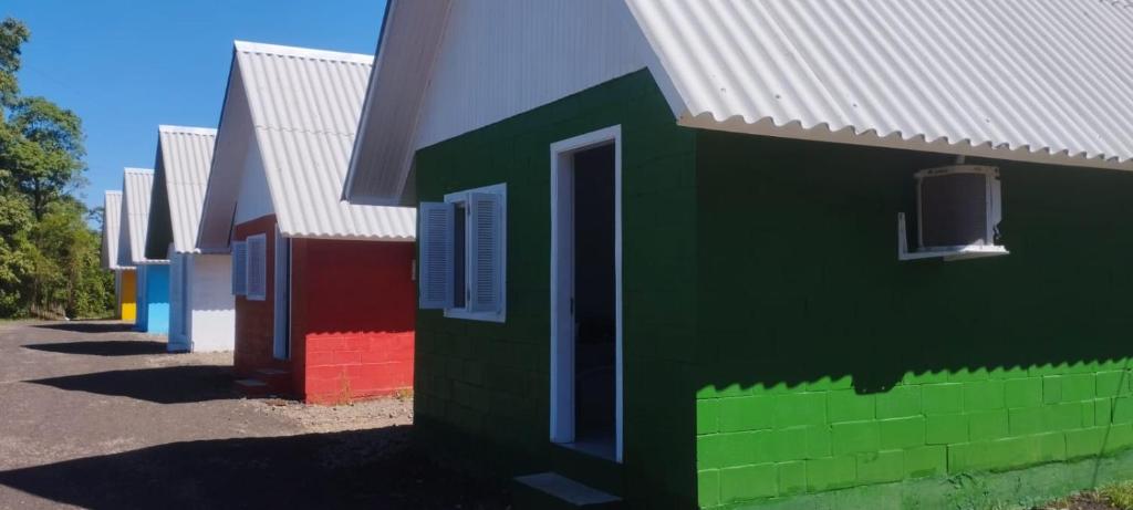 a group of colorful houses are painted in lego at Pousada Gaúcha Caibi 