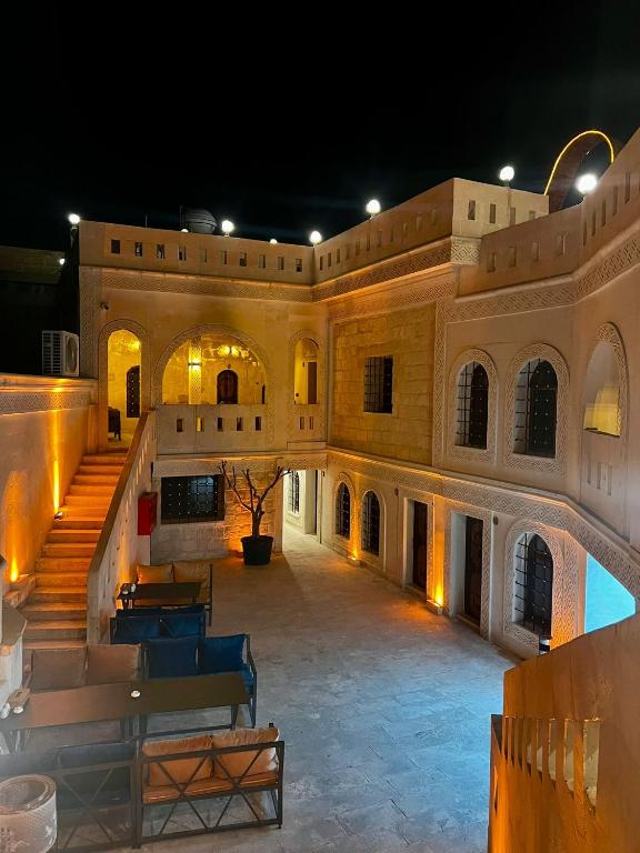 an empty courtyard of a building at night at Beylerbeyi Butik Otel in Midyat