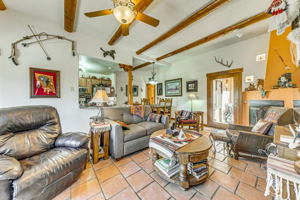 a living room with leather furniture and a ceiling at Comfy Aspen Ridge Home about 3 Mi to Ski Lifts in Cloudcroft