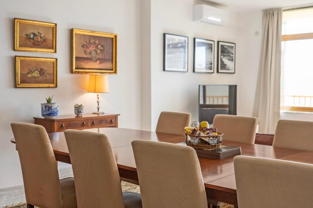 a dining room with a table and chairs at Spacious 3-Bedroom Apartment with Balconies-Central Sliema in Sliema