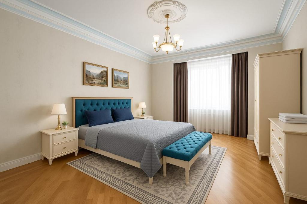 เตียงในห้องที่ Veluna Apartments