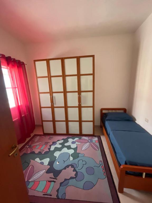 a bedroom with a bed with a cow painted on it at Casa Relax in Simaxis