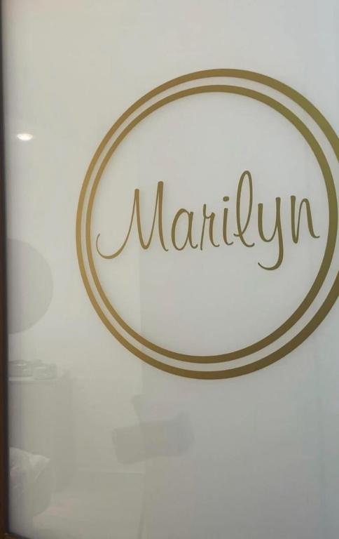 a sign on a glass door with the word marilyn at B&B Le due sorelle in Telese