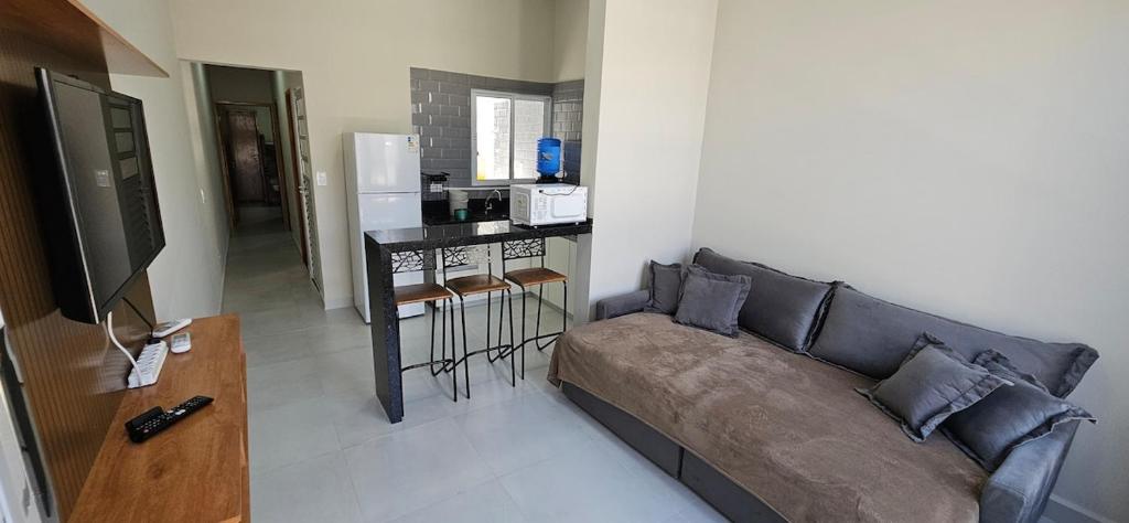 Et tv og/eller underholdning på Casa Aconchegante com Suíte, Ar-Condicionado e Wi-Fi e garagem