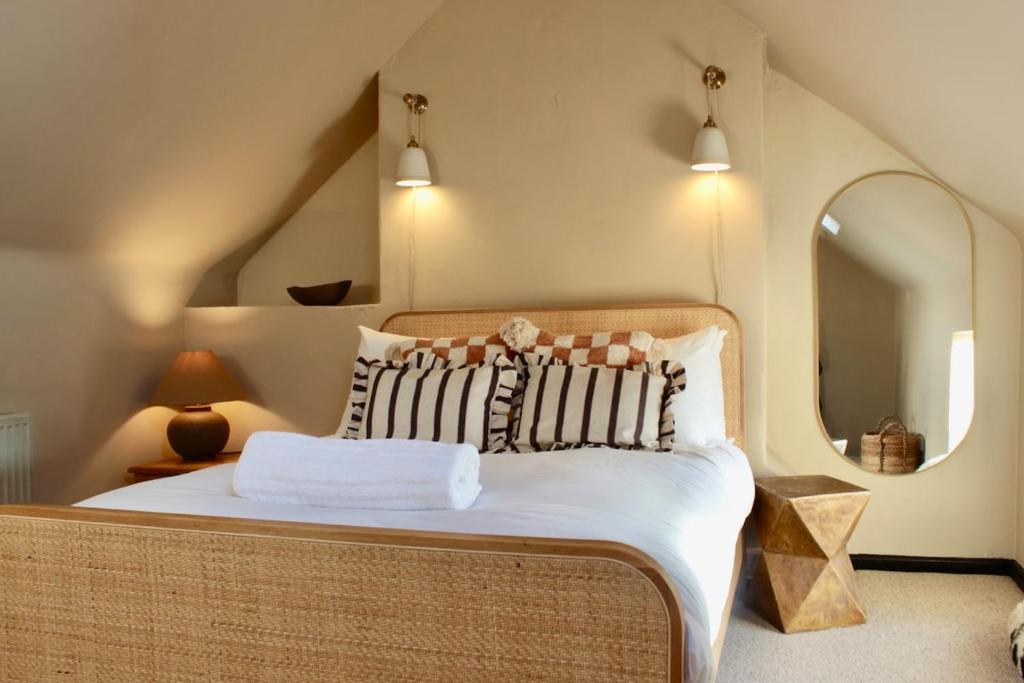 a bedroom with a large bed with a large mirror at NEW! Stylish Chester Townhouse, Sleeps 6 in Chester