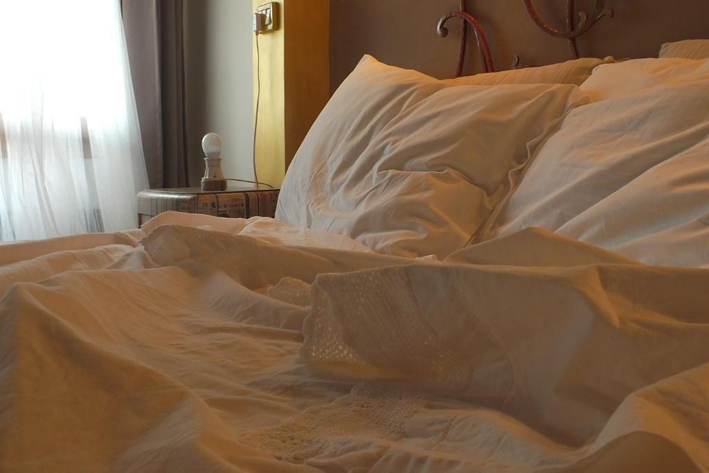 Postel nebo postele na pokoji v ubytování Corte di Maggio B&B