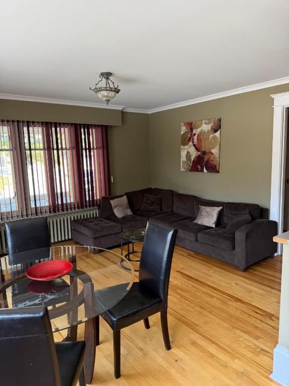 a living room with a couch and a table at Midstream Manor Unit 9 - 2 Bedroom Apartment in St. John's