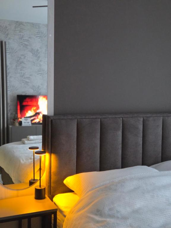 Giường trong phòng chung tại Apartman Elite Stay Doboj