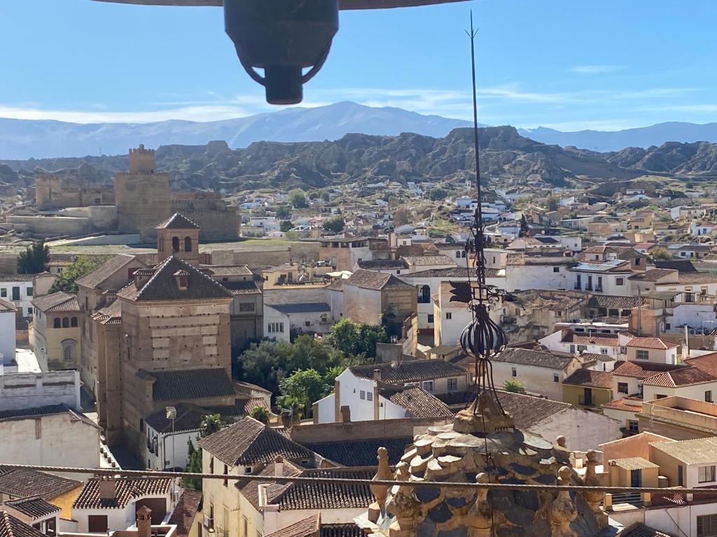 a view of a city from the top of a building at La Azucarera in Guadix