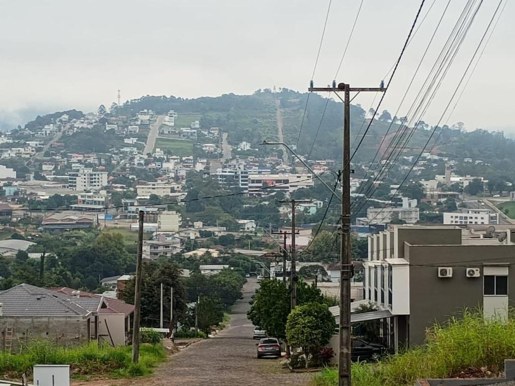 a view of a city from a hill at Casa com visto para o Cristo e cidade in Encantado