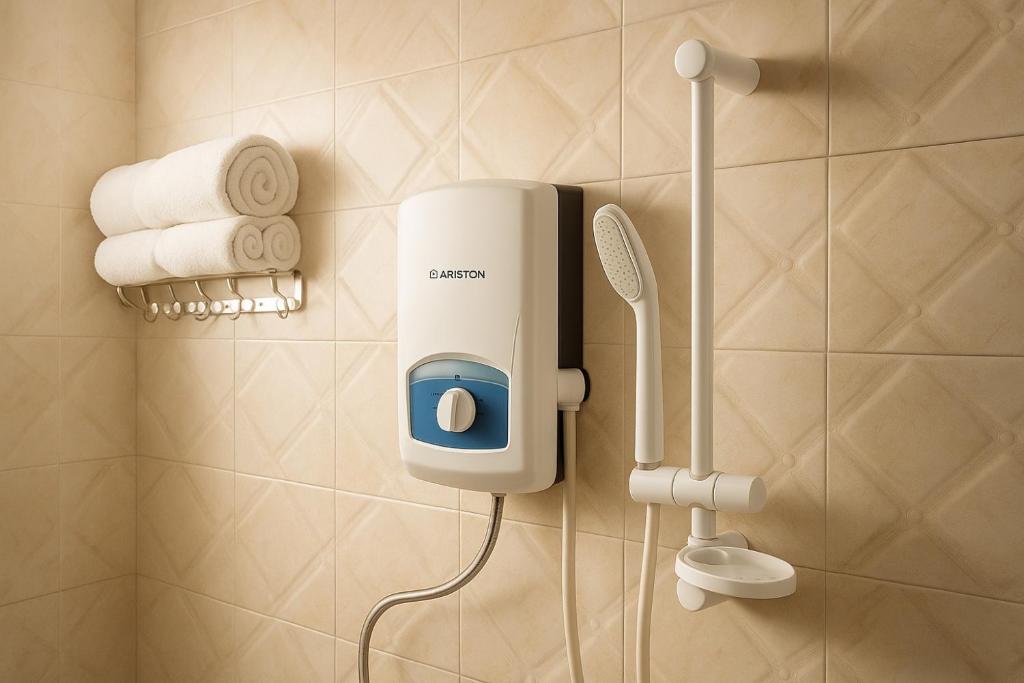 a hair dryer on a wall in a bathroom at Noaz Hotel in Bulambiro