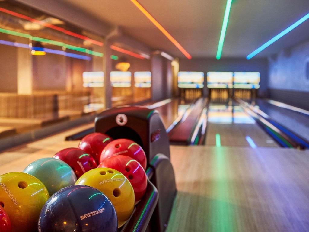 a bowling alley with a bunch of balls on the lanes at ibis styles Bolesławiec in Bolesławiec