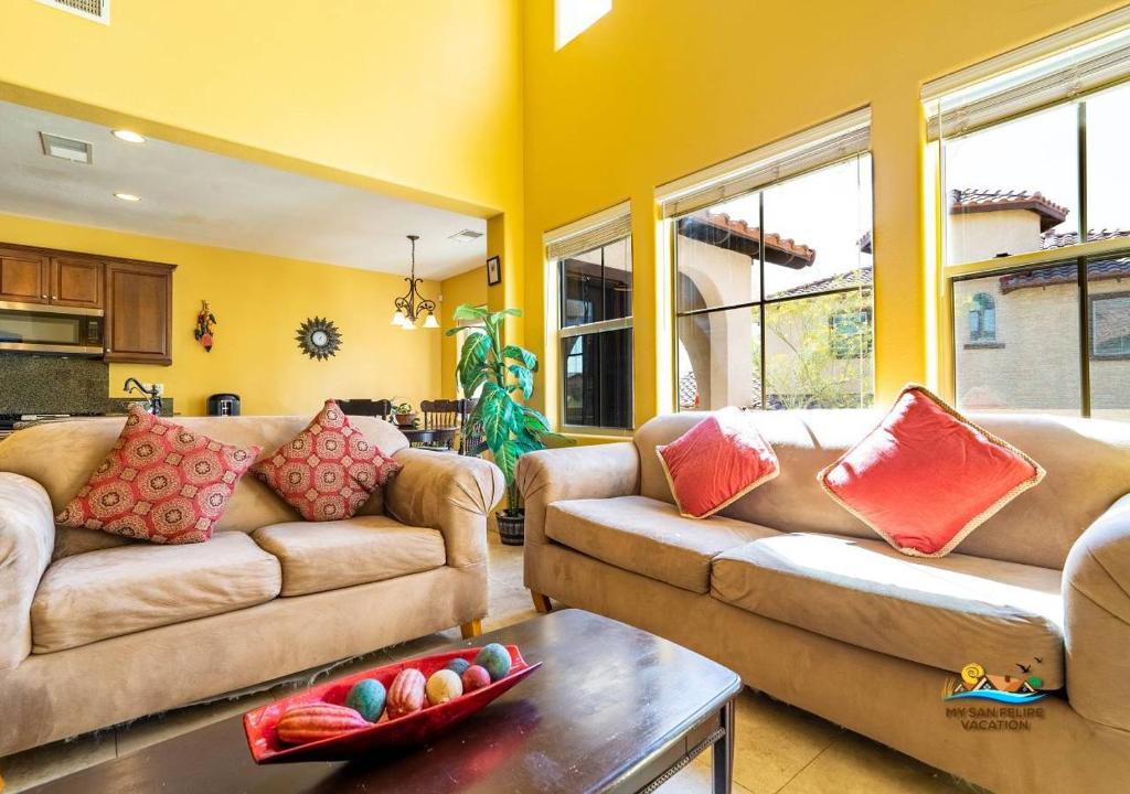 a living room with two couches and a table at Upscale San Felipe Vacation Villa 41-1 in Playa El Paraíso