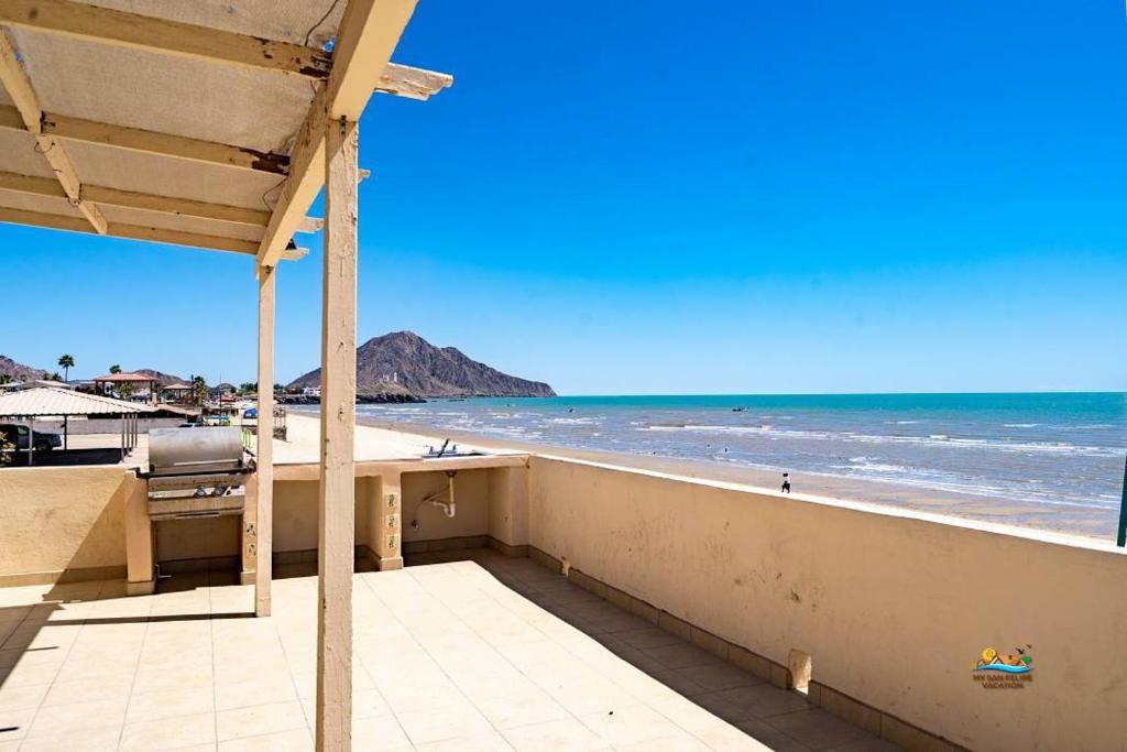 a balcony with a view of the beach at InTown Beach front condo - Casey`s condo 1 in San Felipe