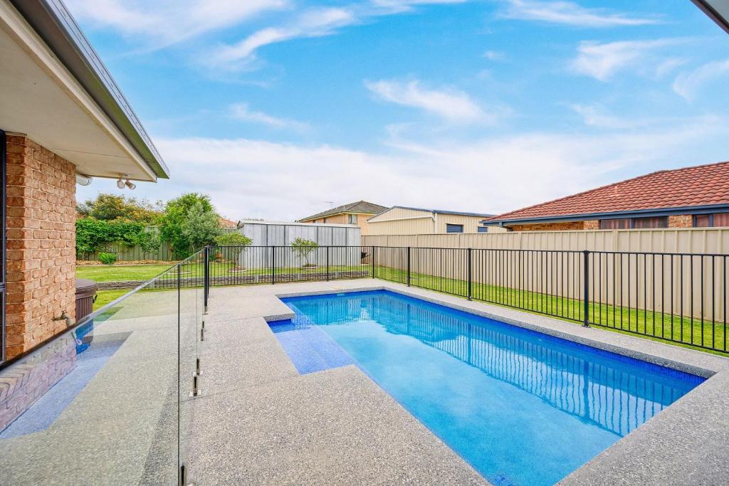 a swimming pool in the backyard of a home at The Drift at Cathie in Lake Cathie